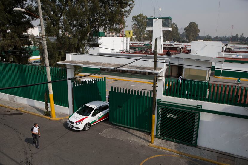 An immigration vehicle exits the compound of the Agujas immigration detention center, where...