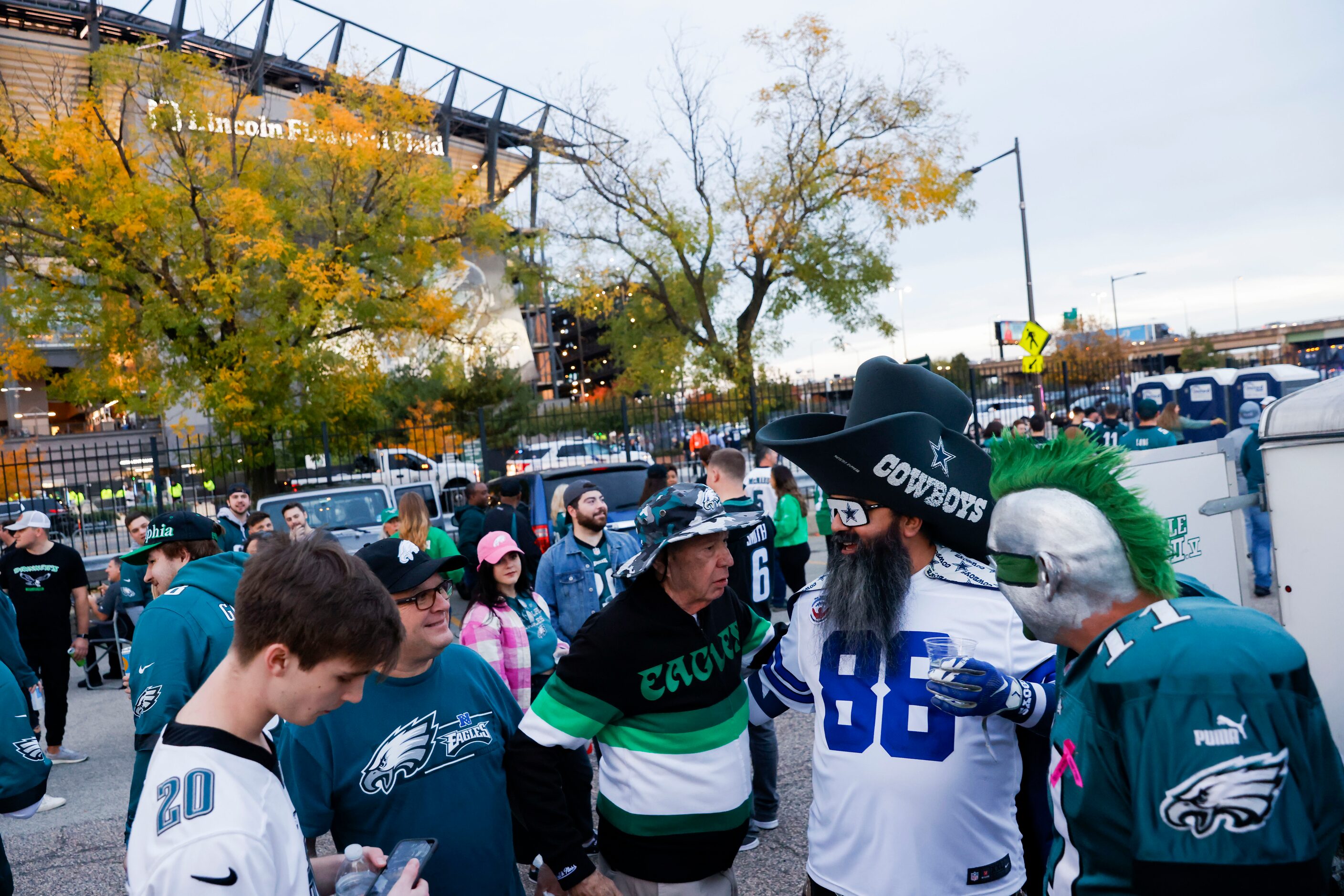 Ed Callahan (center) chats with Matteo Franco and Jamie Pagliei (right) chat before a Dallas...