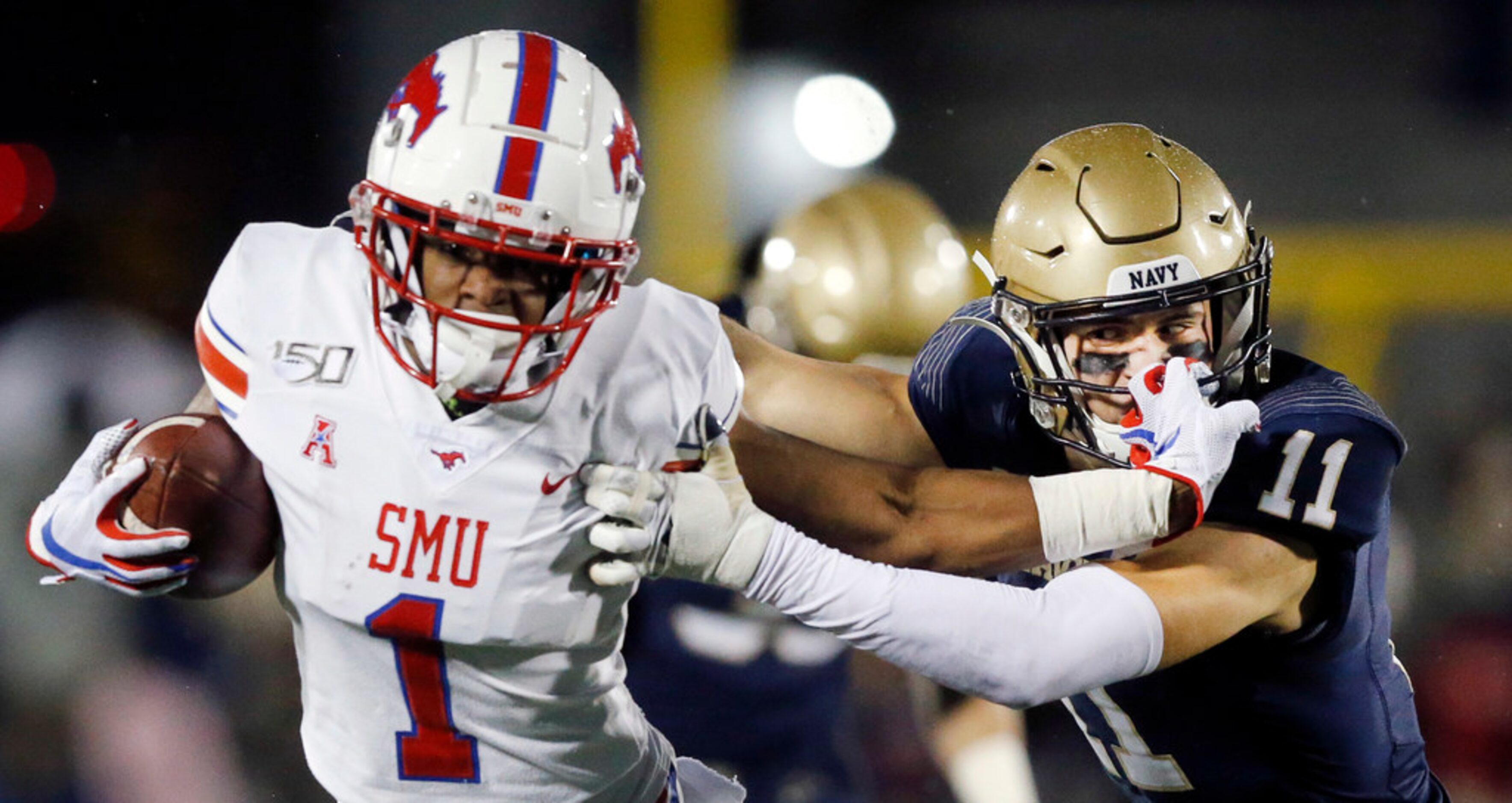 Southern Methodist Mustangs wide receiver CJ Sanders (1) gives Navy Midshipmen safety Evan...