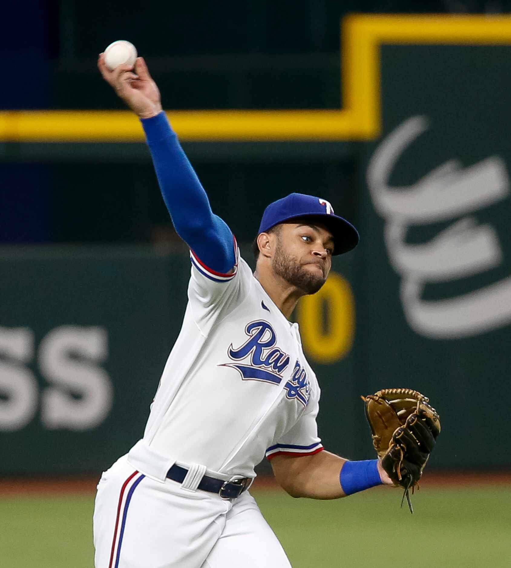 Texas Rangers left fielder Jason Martin (50) throws the ball to the infield during the first...