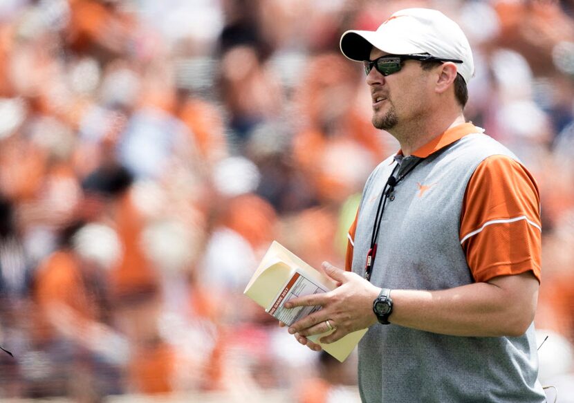 Texas head coach Tom Herman looks on during the Orange and White spring NCAA college...