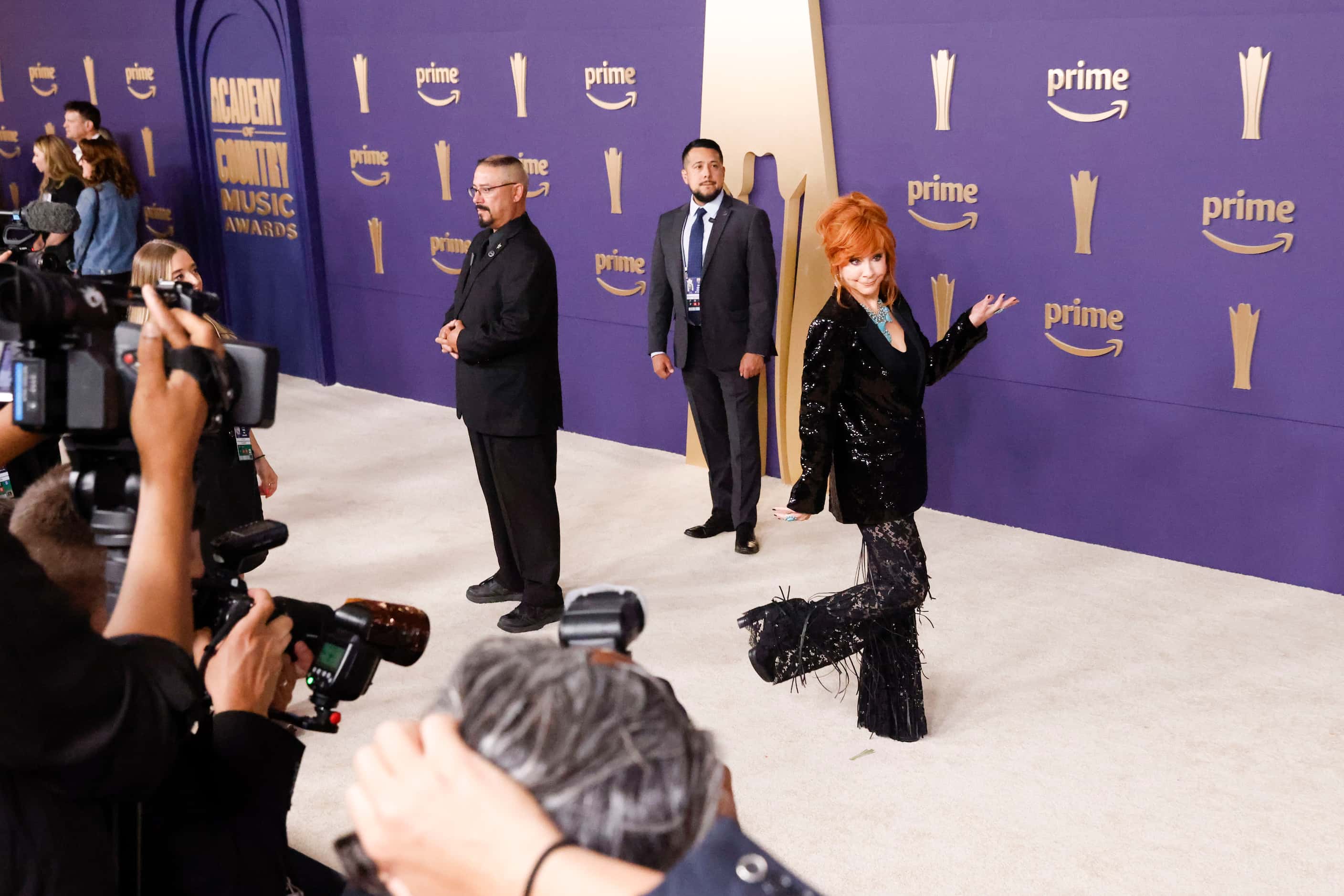 Reba McEntire poses for the photographers as she arrives at the 59th Academy of Country...