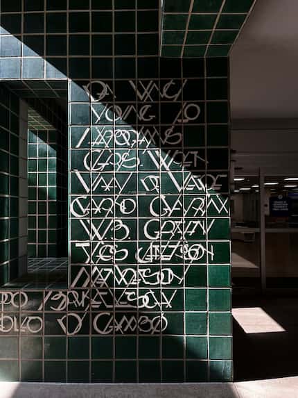 Stylized names of architects on the facade of the UTA College of Architecture Planning and...