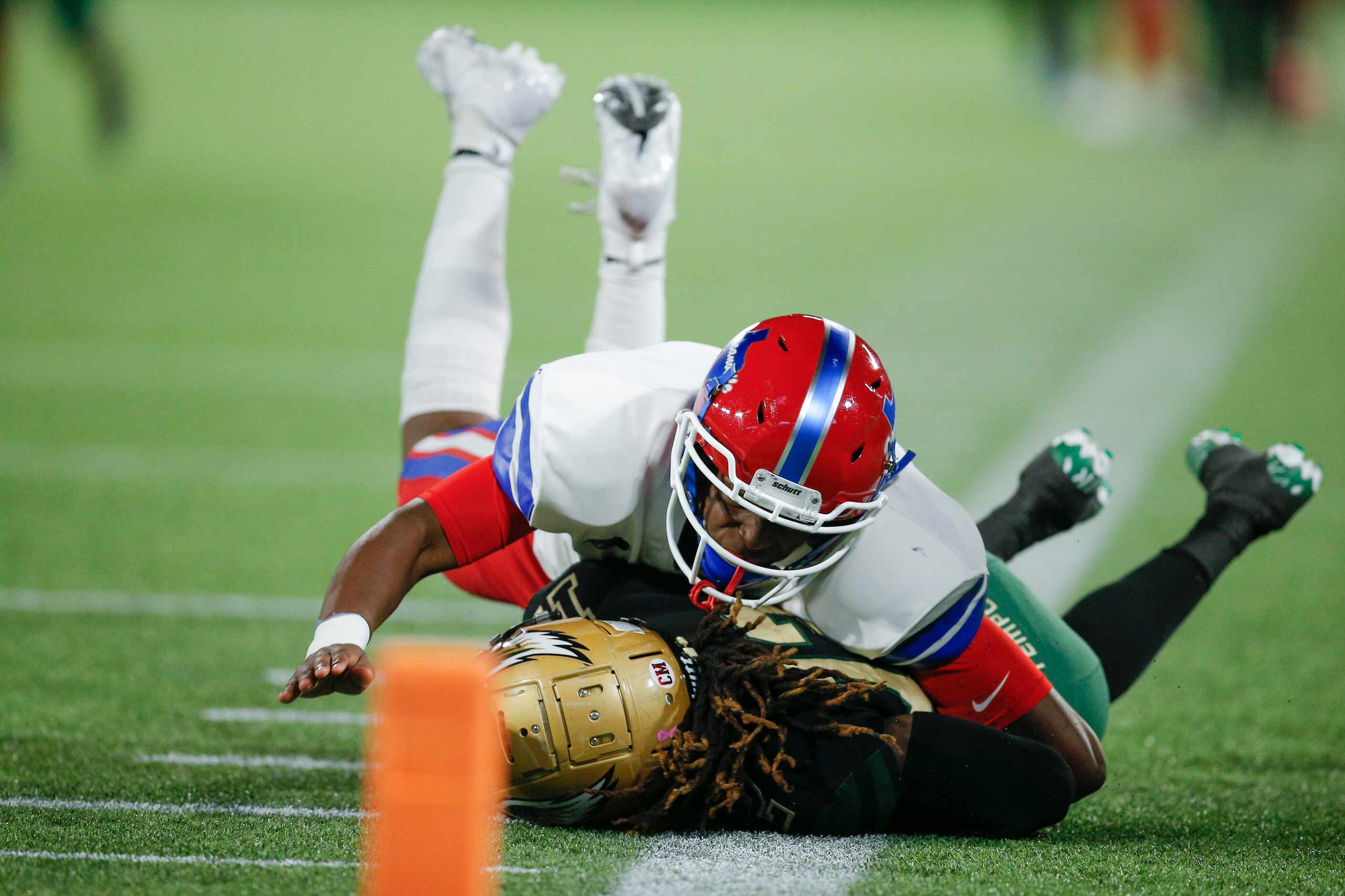 Duncanville senior defensive lineman Elijah Wilson (51) tackles DeSoto senior Adonis Scott...