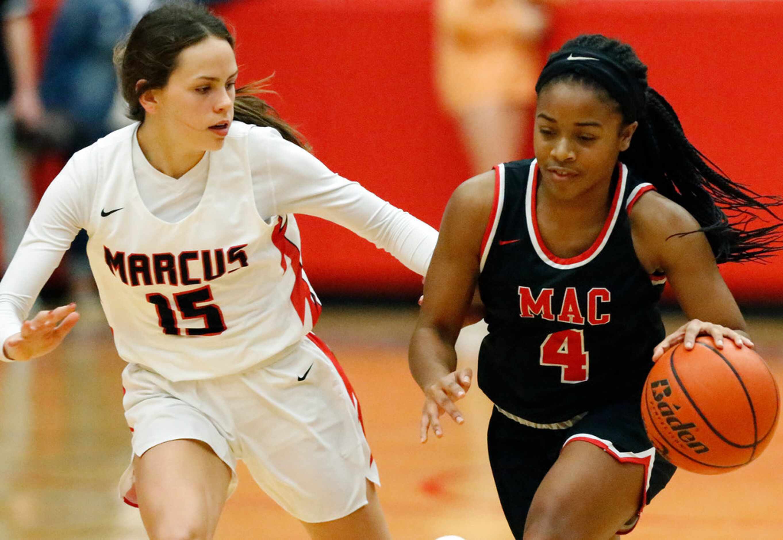 Irving MacArthur High School guard Morgan Browning (4) brings the ball down the court as she...