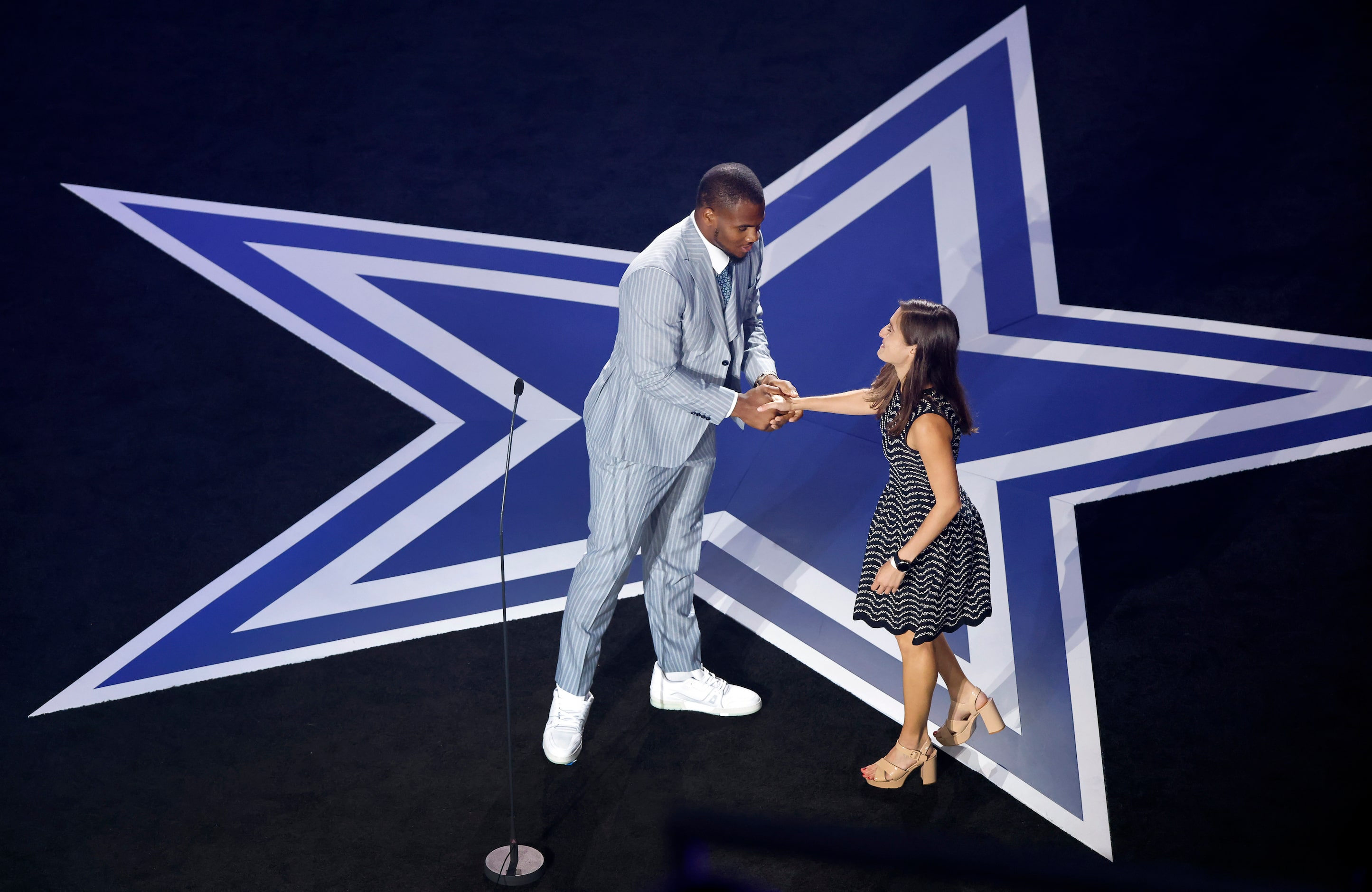 Dallas Cowboys linebacker Micah Parsons congratulates USA Today Cowboys beat writer Jori...