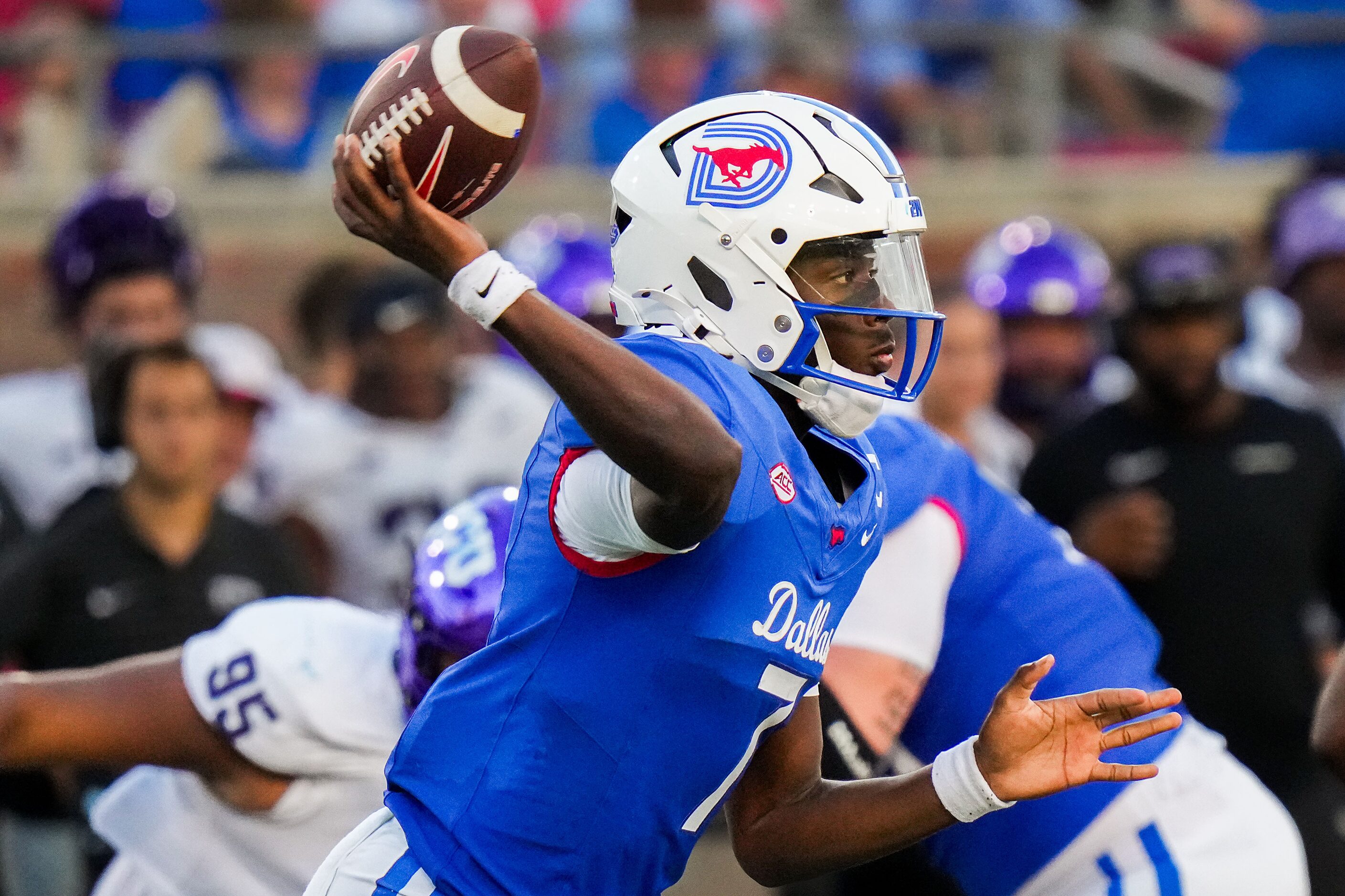 SMU quarterback Kevin Jennings (7) throws a pass during the second half of an NCAA football...