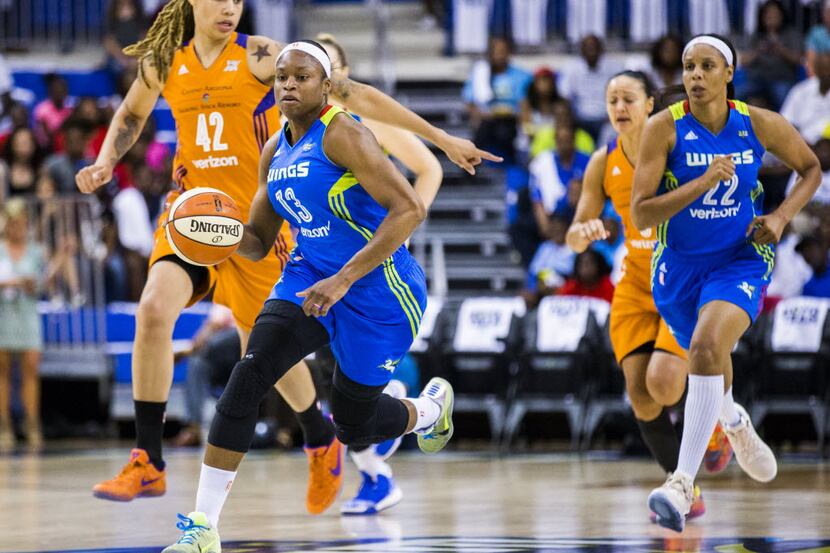 Dallas Wings guard Karima Christmas (13) makes her way down the court during the first...