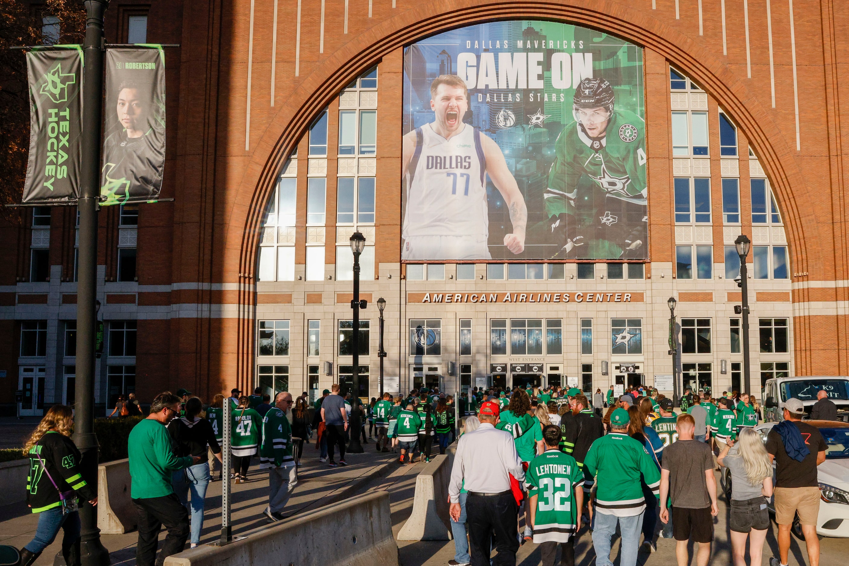 Hockey fans enter the arena before the start of the Dallas Stars home opener against the...