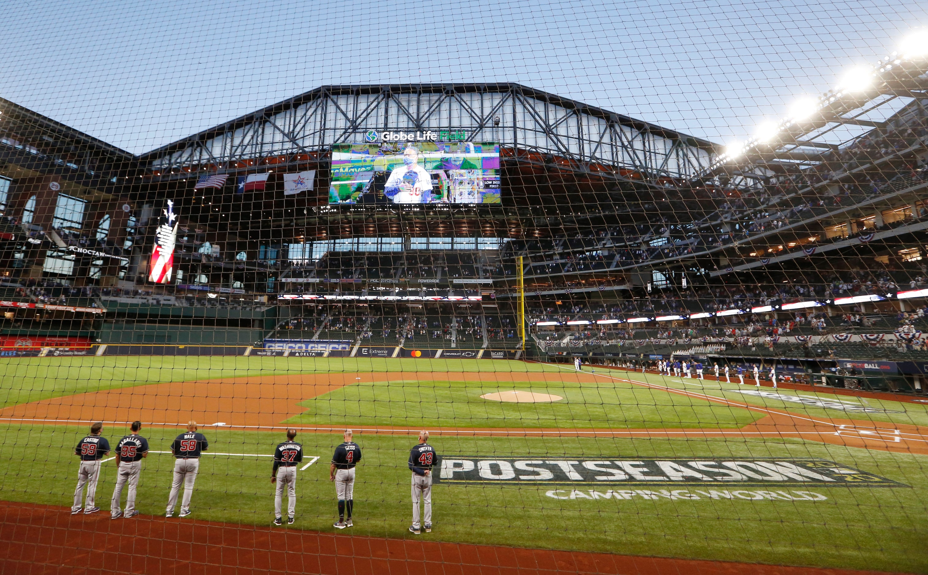 Atlanta Braves and Los Angeles Dodgers lineup for the playing of the national anthem in game...