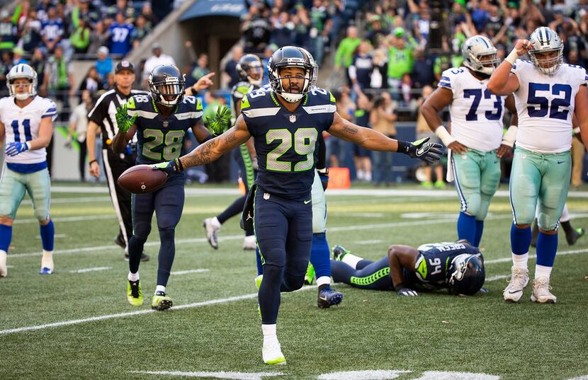 Seattle Seahawks defensive back Earl Thomas taunts the Dallas Cowboys bench after...