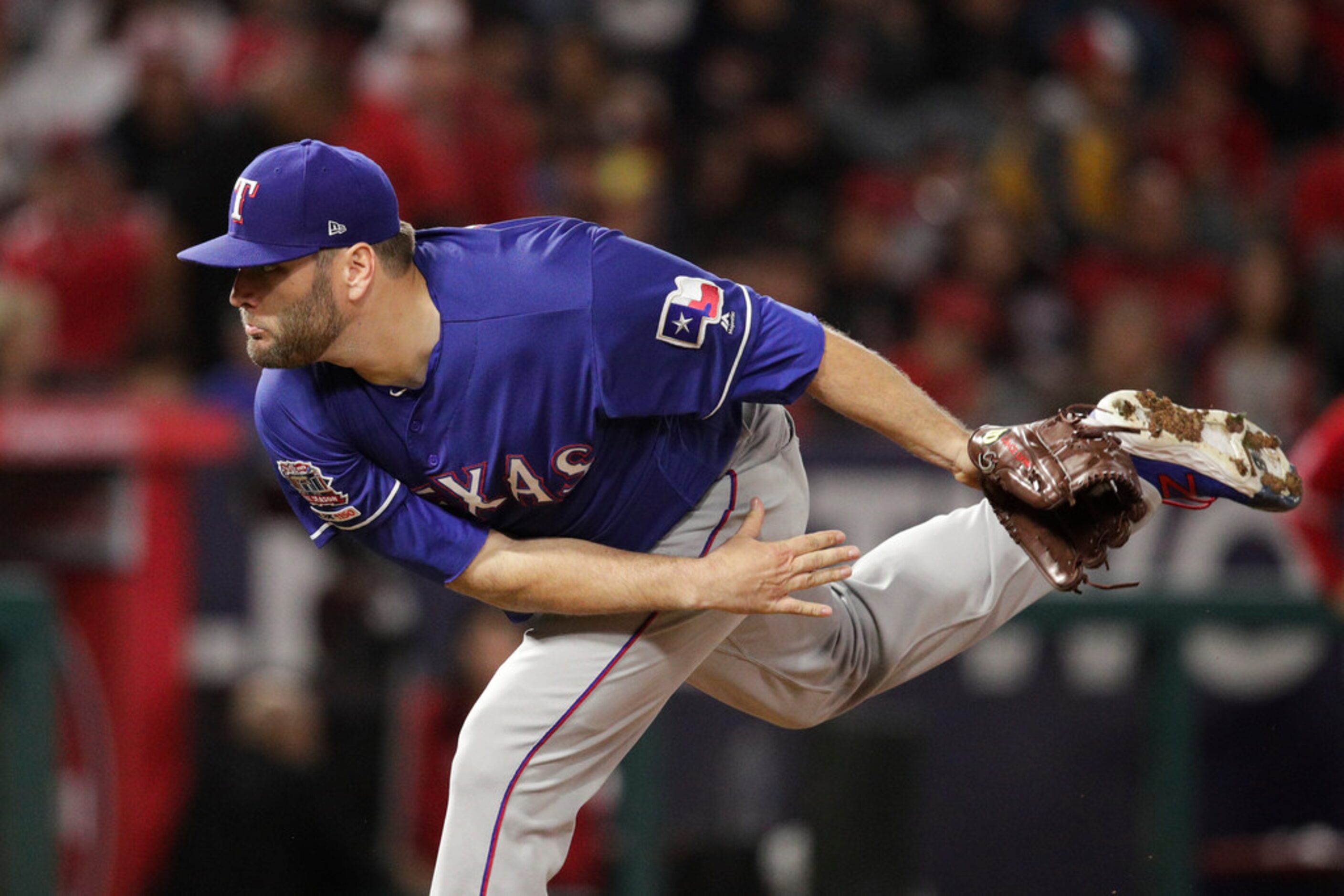 Texas Rangers starting pitcher Lance Lynn throws to a Los Angeles Angels batter during the...