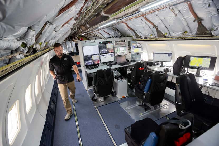 Flight test engineer Garrett Sheets walks through Honeywell Aerospace Technologies’s Boeing...
