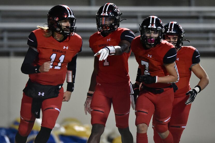 The Braswell football team celebrates after they score against the Corsicana defense at C.H....