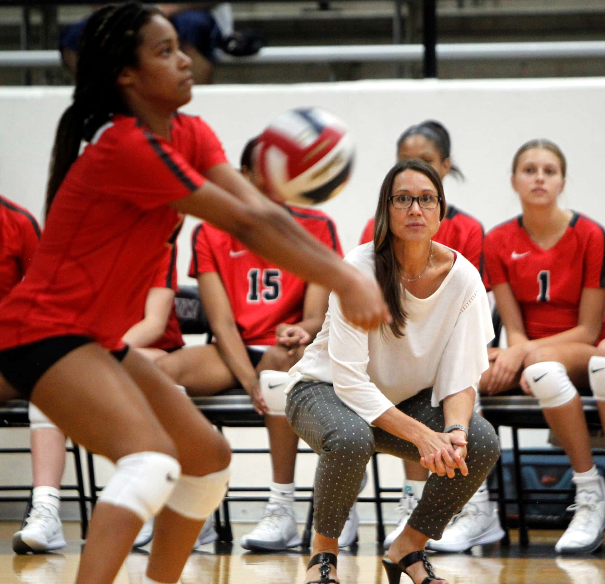 Arlington Martin head coach Rhonda Dunn looks on from the team bench as Aubrey Wright (2)...