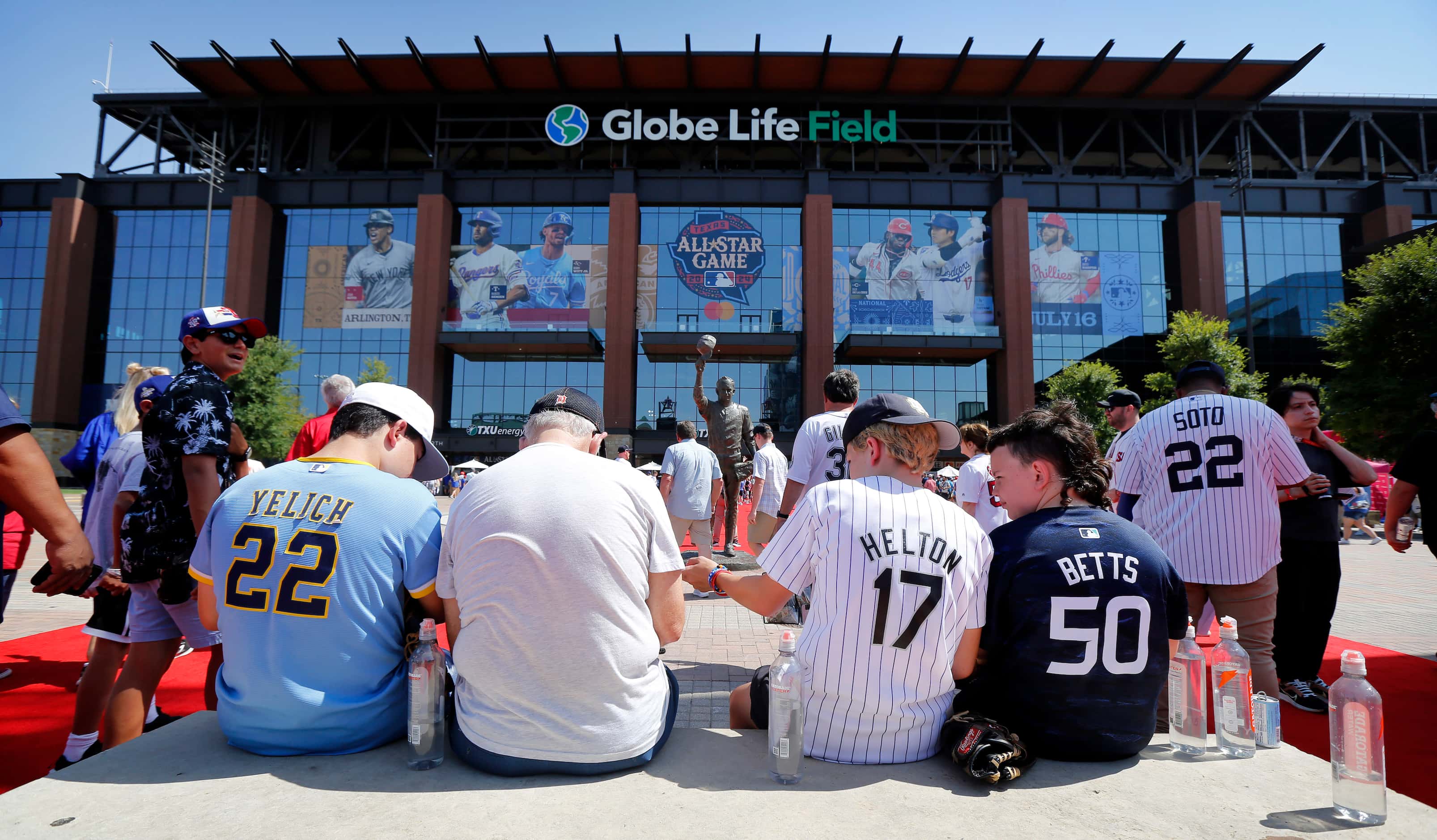 Baseball fans wait for the doors to open for the MLB All-Star Game at Globe Life Field in...