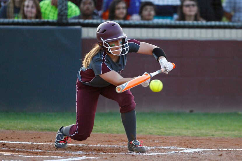 Wylie's Katelyn Belch (2) hits a sacrifice bunt to advance Jessica Lee (22) to second base...