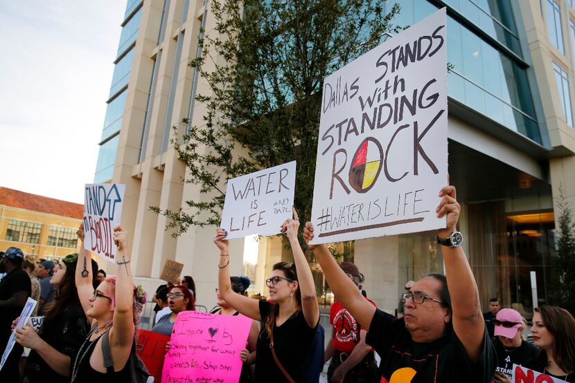 People standing outside developer Energy Transfer Partners headquarters protest the Army...