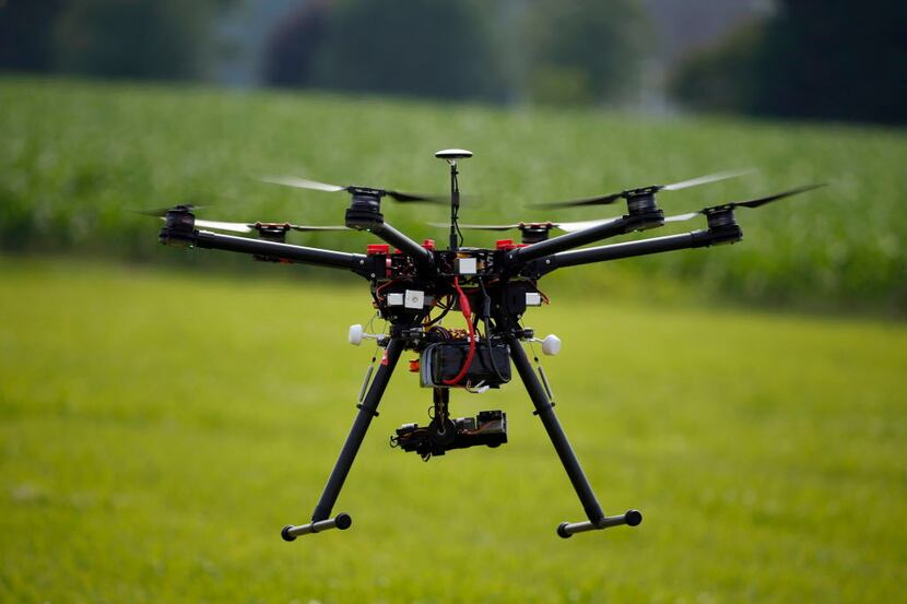In this June 11, 2015, file photo, a hexacopter drone is flown during a drone demonstration...