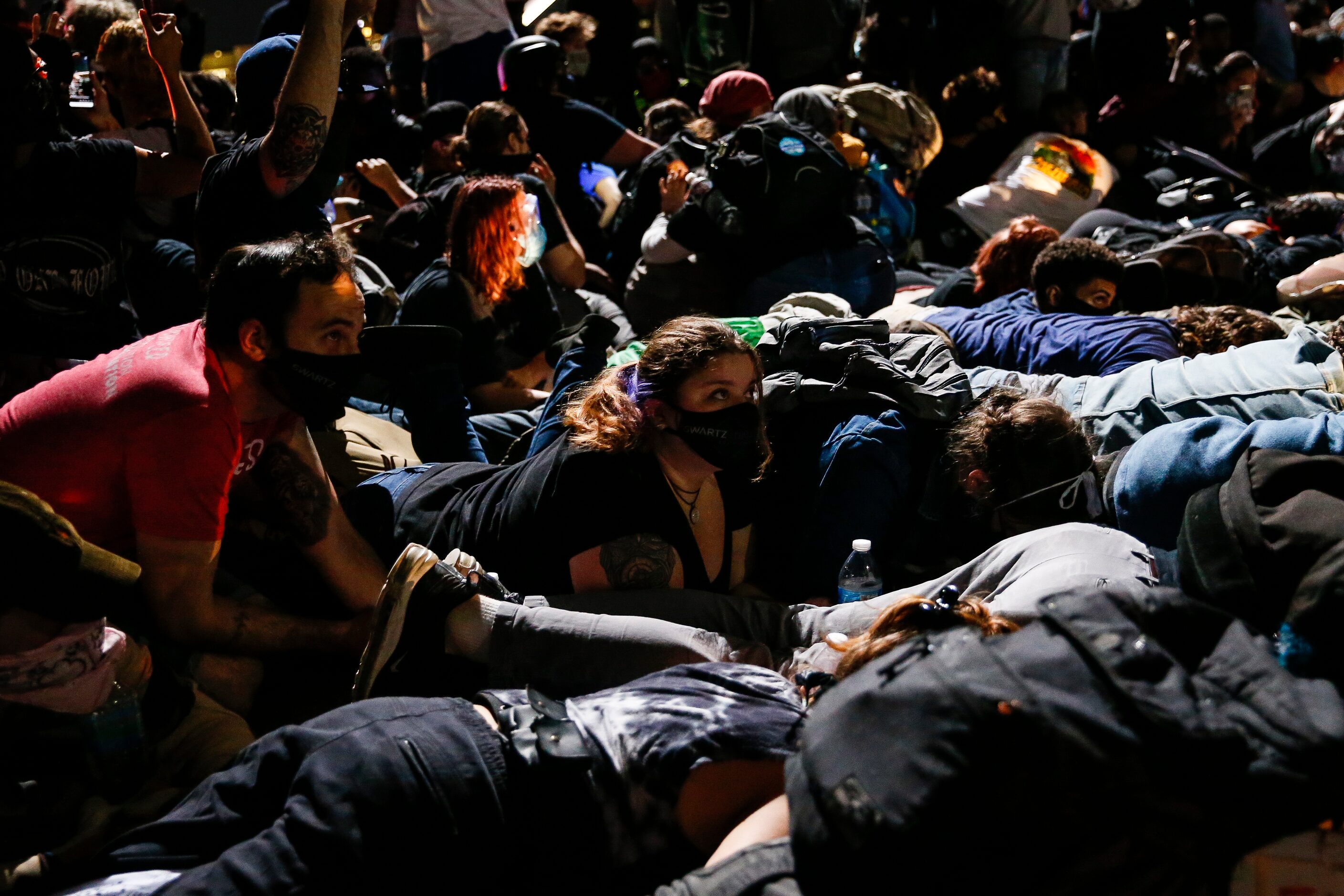 Police surround and detain hundreds of protesters who marched onto the Margaret Hunt Hill...