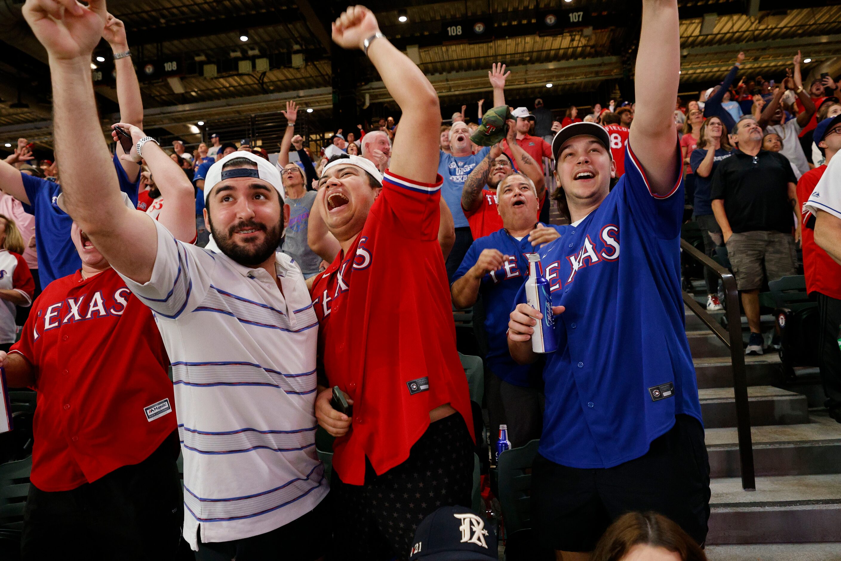 Texas Rangers fans Emilio Marquez, from left, Matthew Uranga and Scout Aswad, everybody from...