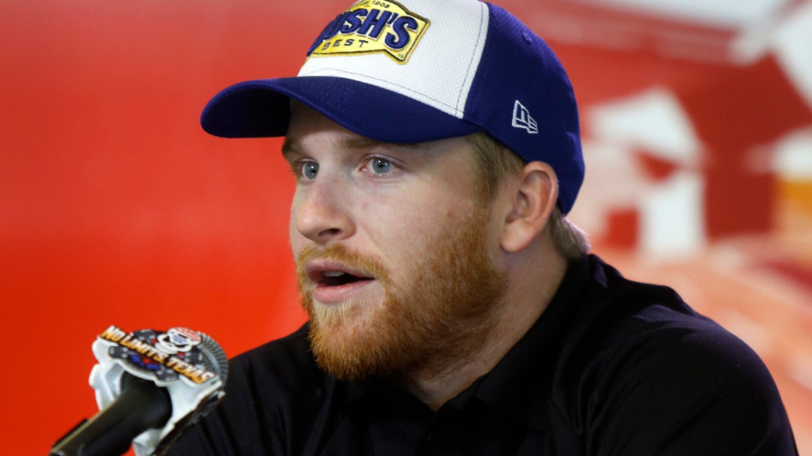 NASCAR driver Chris Buescher speaks during a press conference to unveil the new track at...