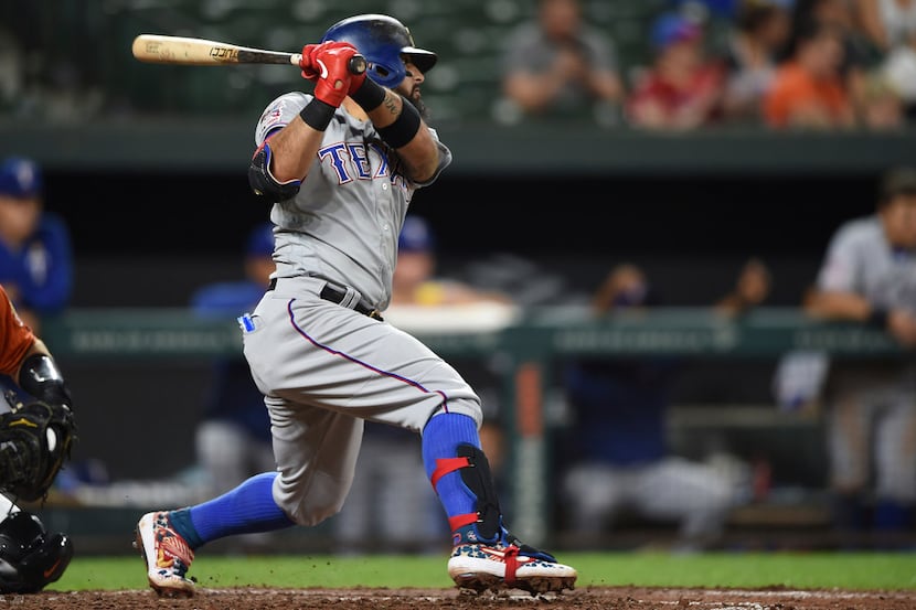 Texas Rangers Rougned Odor follows through on a double against the Baltimore Orioles in the...