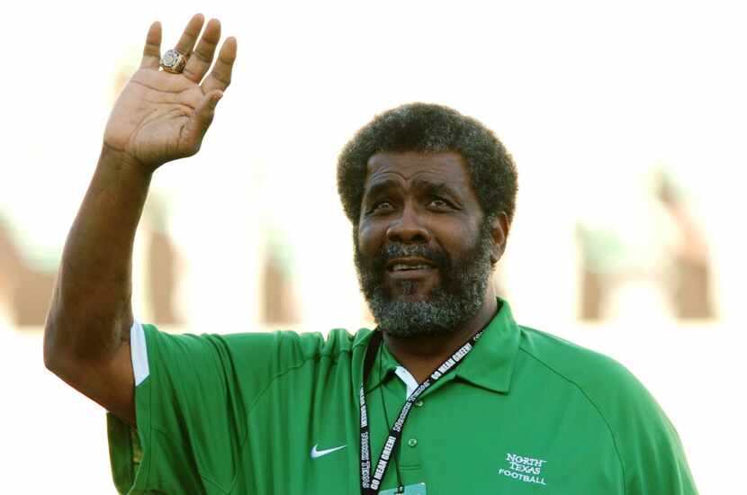 NFL hall-of-famer Mean Joe Greene waves to the crowd before kickoff as the University of...