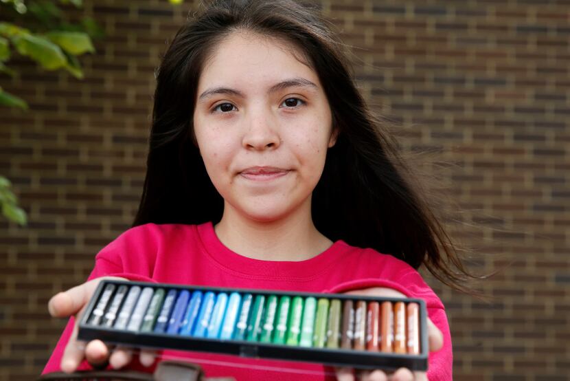 Annette Quintana, 14, of La Porte, brought her art supplies with her as she took shelter at...