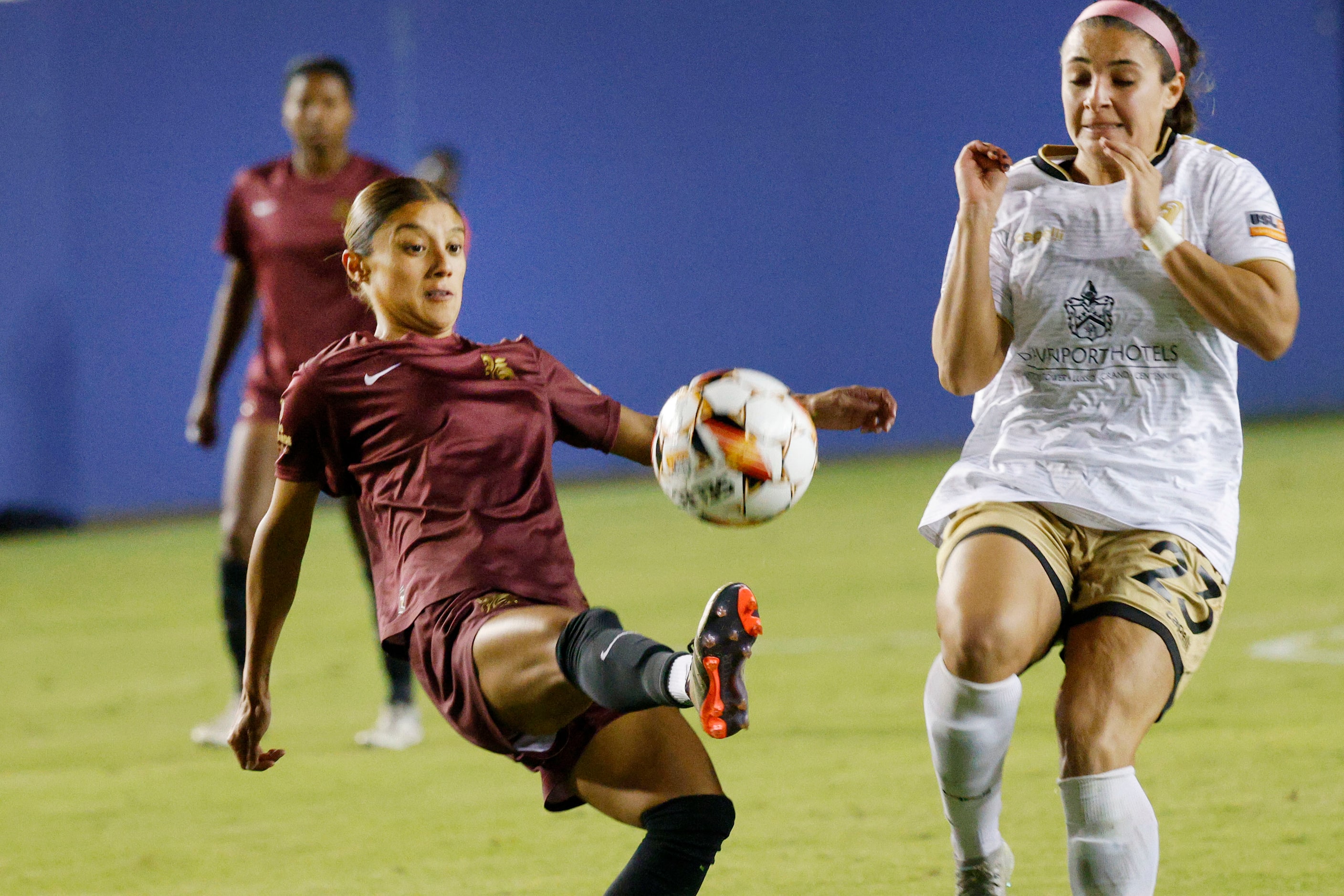 Dallas Trinity forward Natalie Wagner (25) kicks the ball against Spokane Zephyr midfielder ...