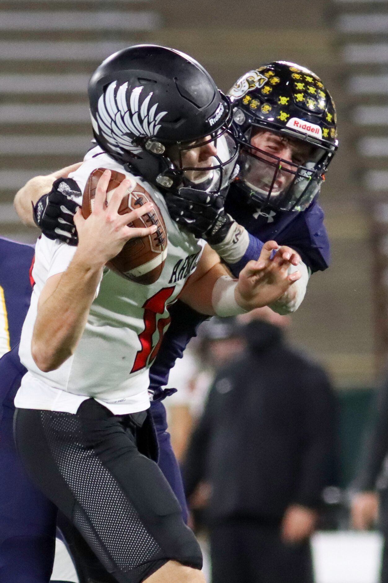 Stephenville linebacker Colton Accomazzo (7) tackles Argyle quarterback CJ Rogers (12)...