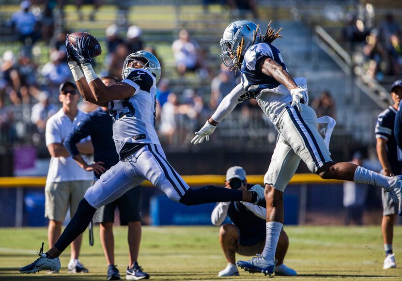 Cowboys wide receiver Jalen Guyton (83) makes a catch in the end zone over defensive back...