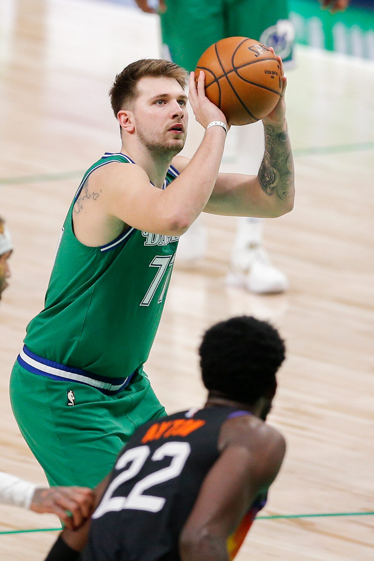 Dallas Mavericks guard Luka Doncic (77) attempts a free throw during the second half of an...