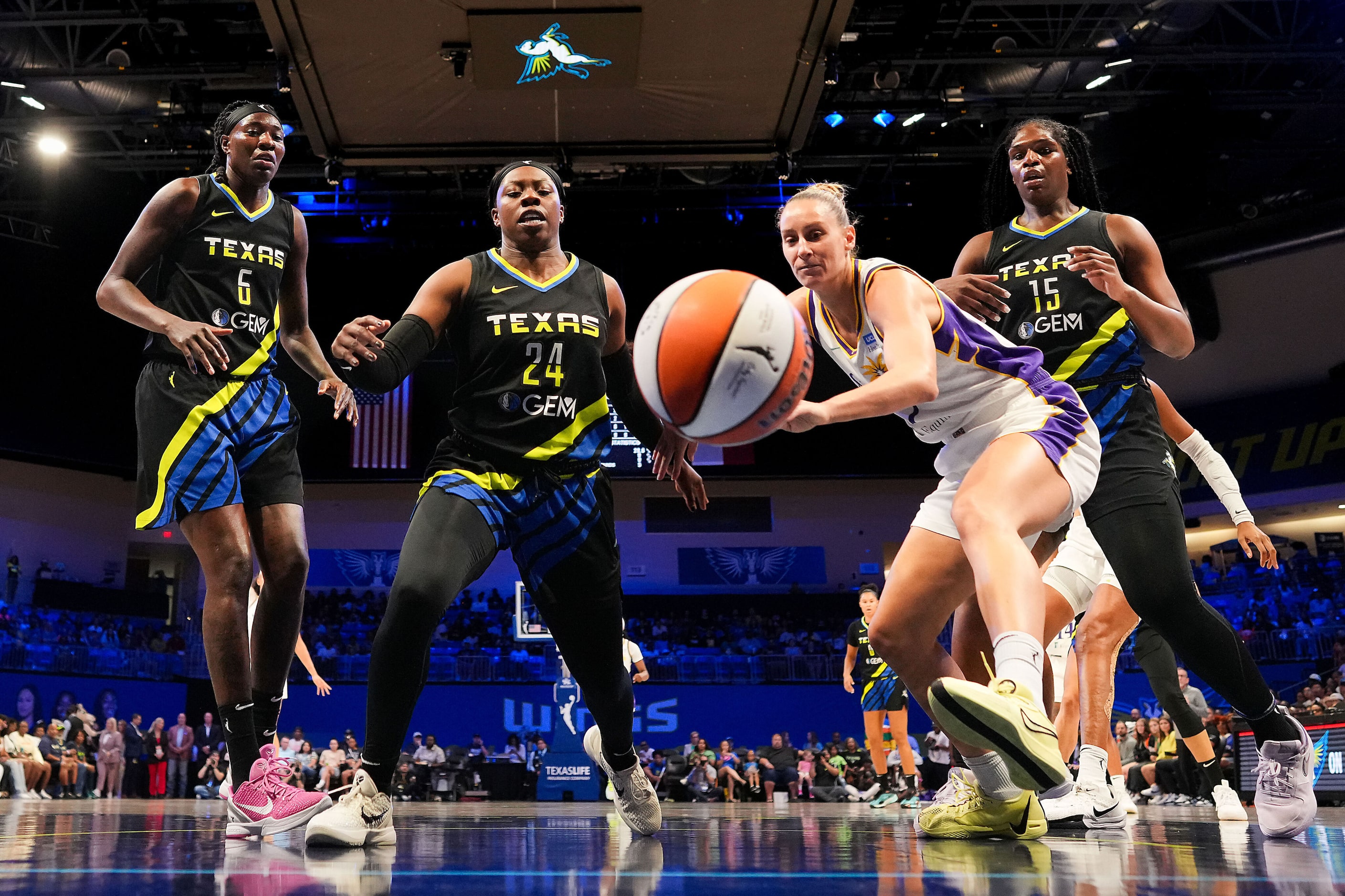 Dallas Wings guard Arike Ogunbowale (24) and Los Angeles Sparks forward Stephanie Talbot (7)...