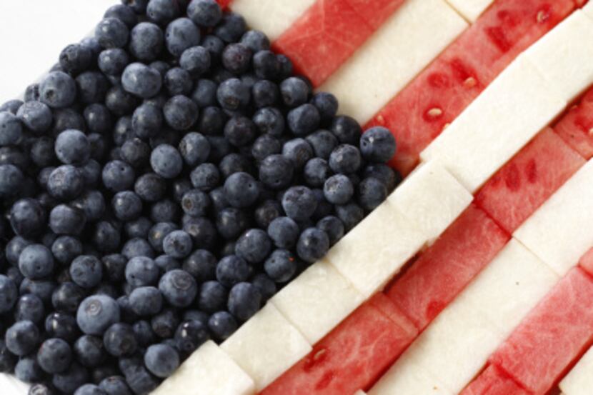 The stars are blueberries and the stripes are watermelon and jicama. Serve the dressing on...