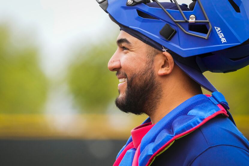 Texas Rangers catcher Jose Trevino smiles after the end of an inning during a “B” game on...