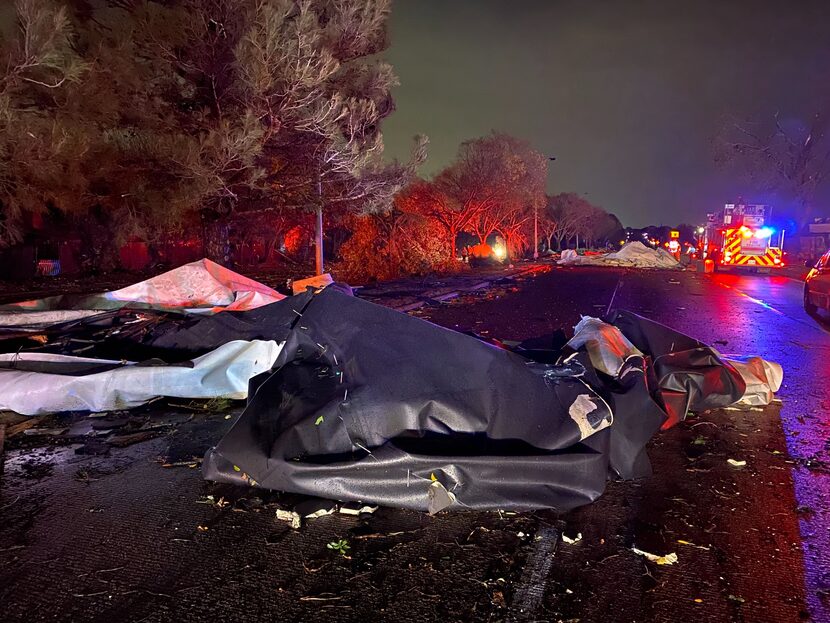 High winds in Arlington scattered debris from an apartment complex along Pioneer Parkway...