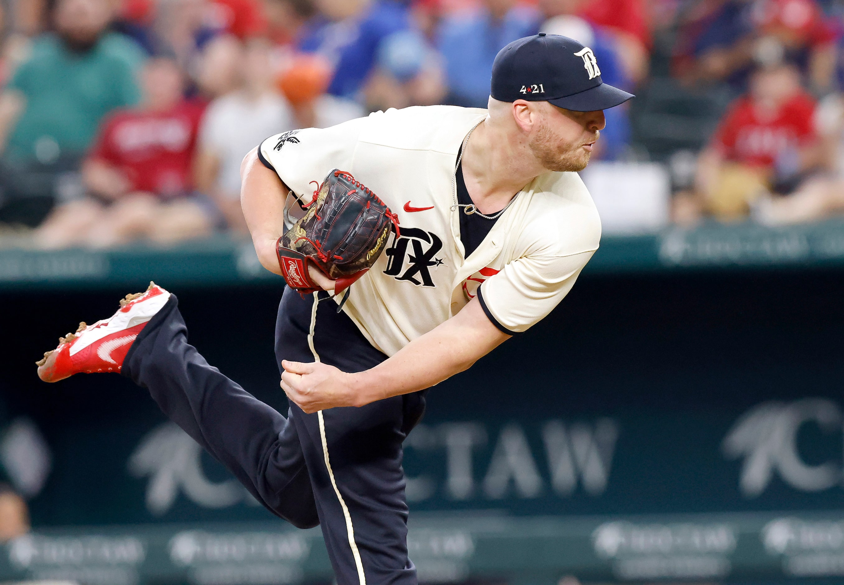 Texas Rangers relief pitcher Will Smith (51) throws against the Cleveland Guardians during...