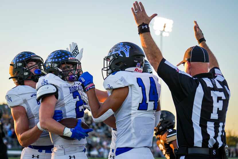 Trophy Club Byron Nelson’s Aaron Darden (2) celebrates with wide receiver Landon...