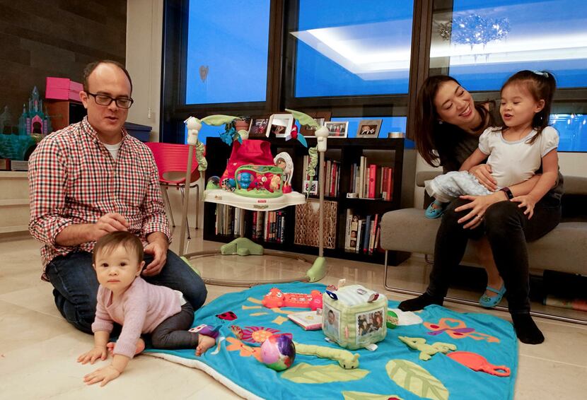 Elise Hu, NPR reporter, spends time with her husband, Matt Stiles, and daughters Isa, 2, and...