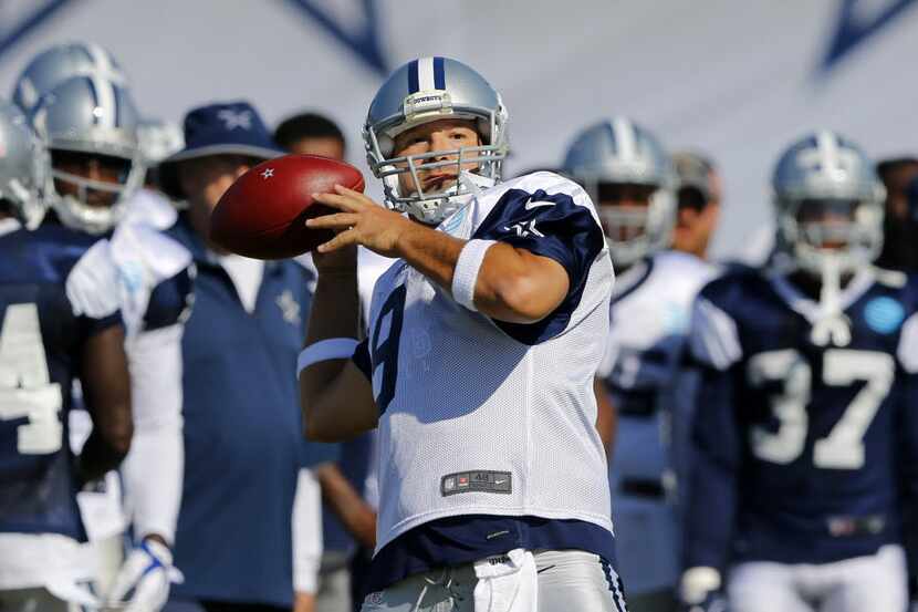 Dallas Cowboys quarterback Tony Romo (9) looks deep to a receiver before throwing during...