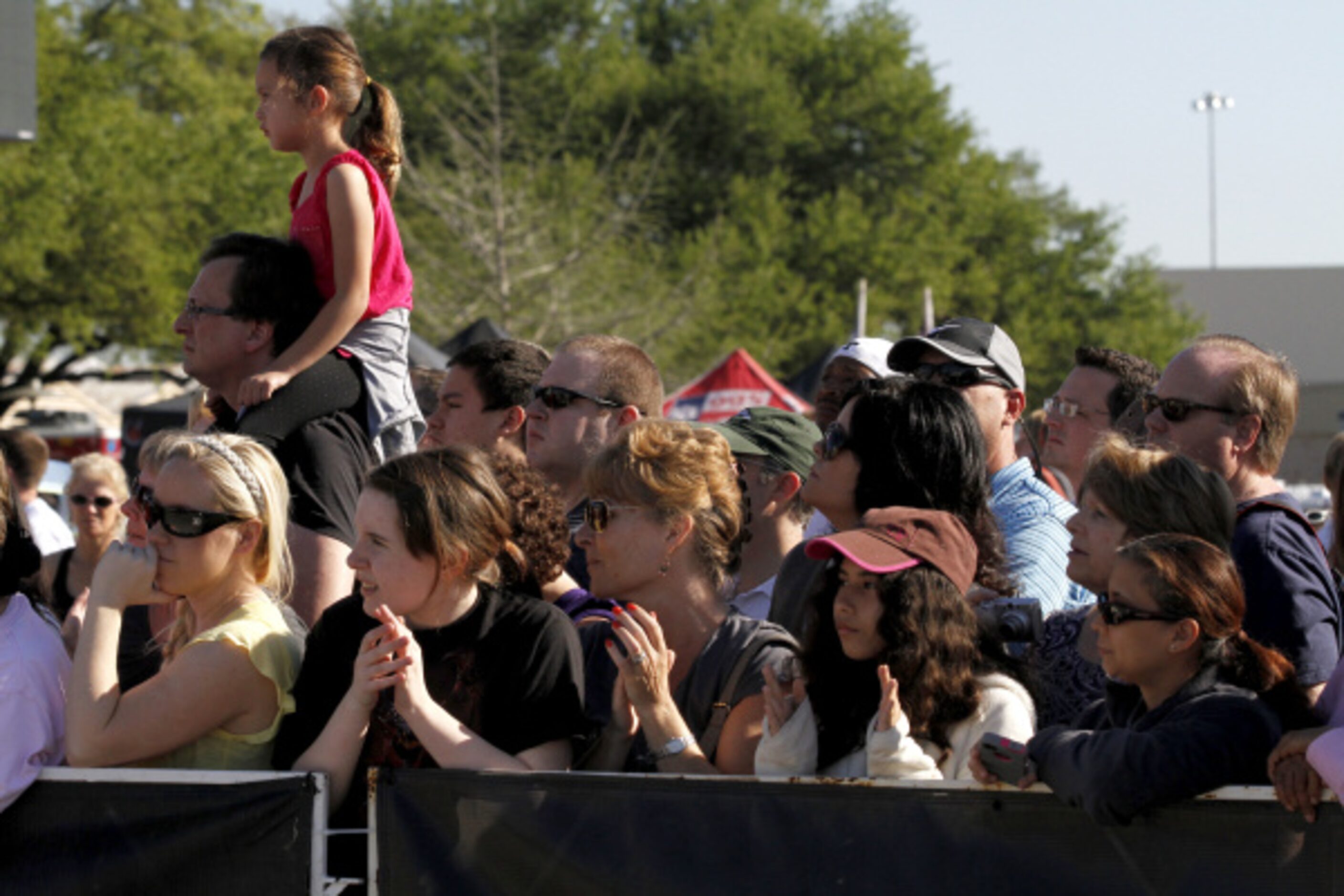 Dallas Rock 'N' Roll half marathon spectators watch as runners make their way into Fair Park...