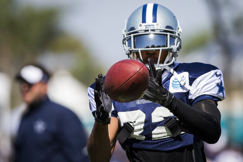 Dallas Cowboys cornerback Orlando Scandrick catches a pass during afternoon practice at...