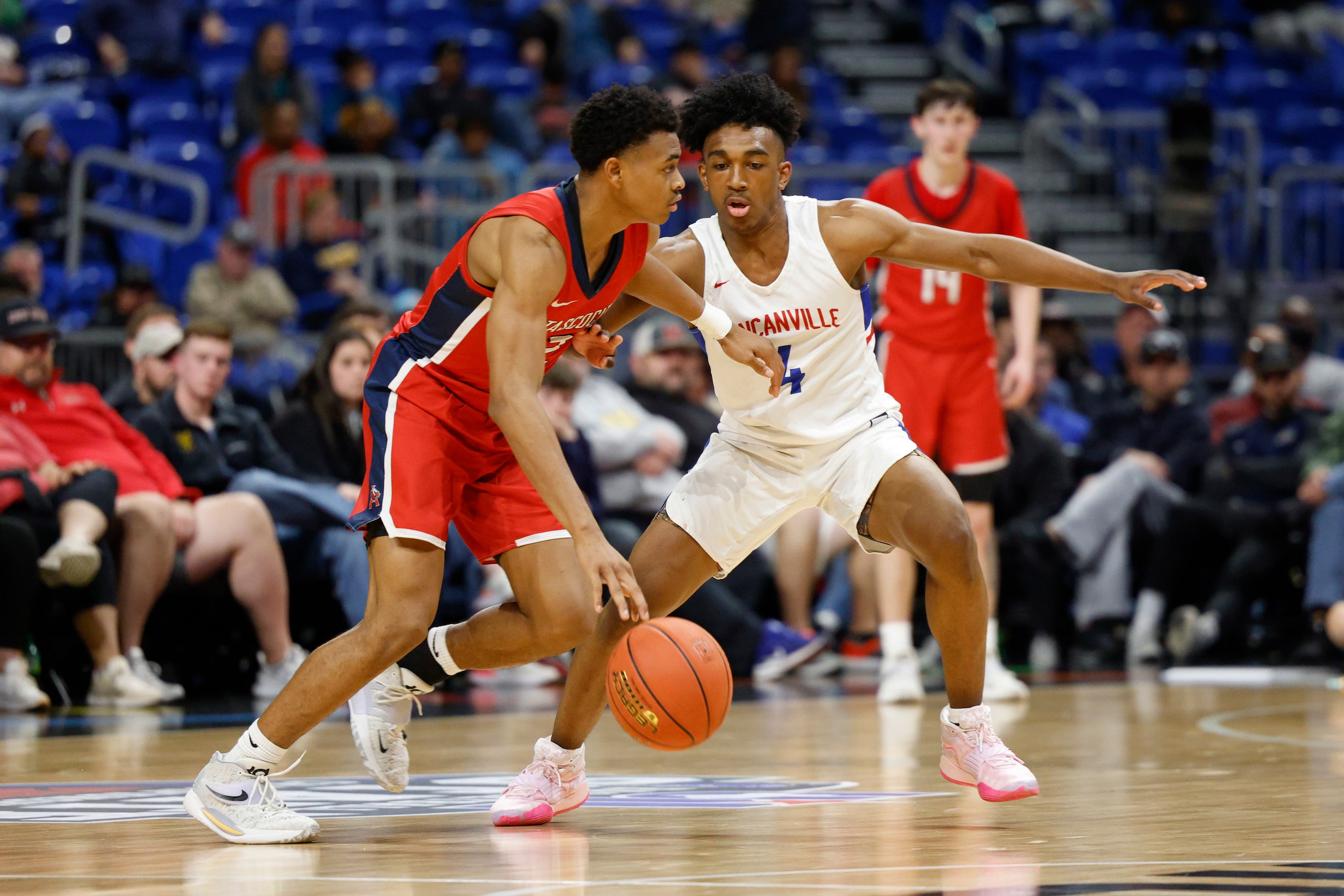 Duncanville guard Caleb Jones (4) defends Humble Atascocita guard Angel Johnson (2) during...