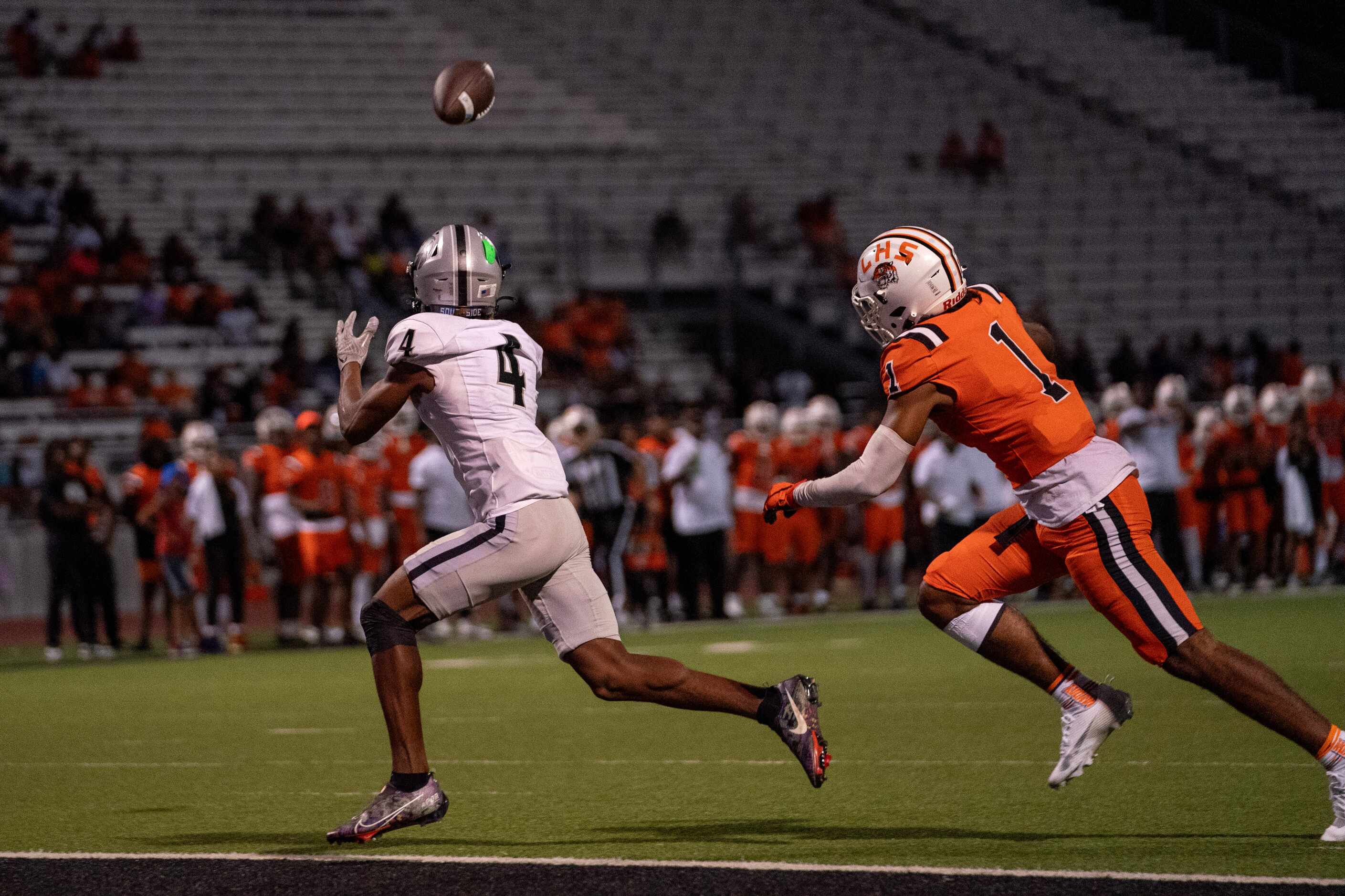 Denton Guyer senior wide receiver Josiah Martin (4) hauls in a touchdown pass in front of...