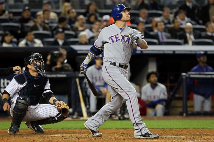 NEW YORK - OCTOBER 19:  Josh Hamilton #32 of the Texas Rangers hits a solo home run in the...