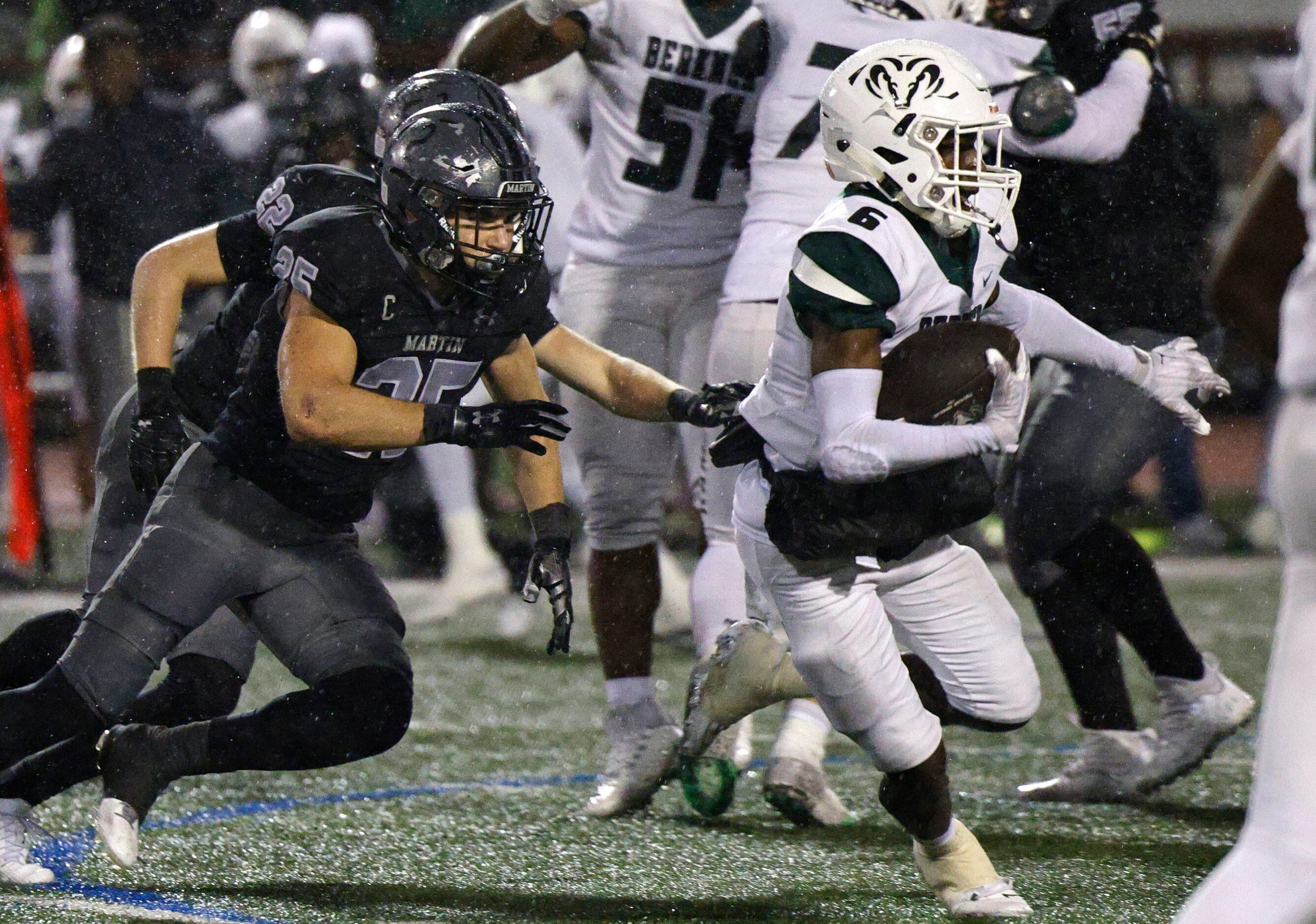 Berkner's Dameon Crowe (6) carries the ball as Martin's Jake Landrum (25) and Martin's...