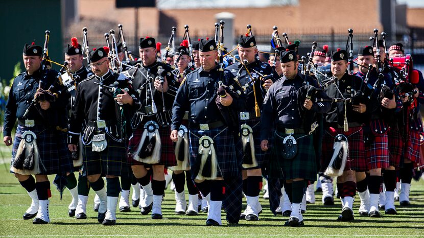  Honor guard members take their places during a memorial service for Euless police officer...