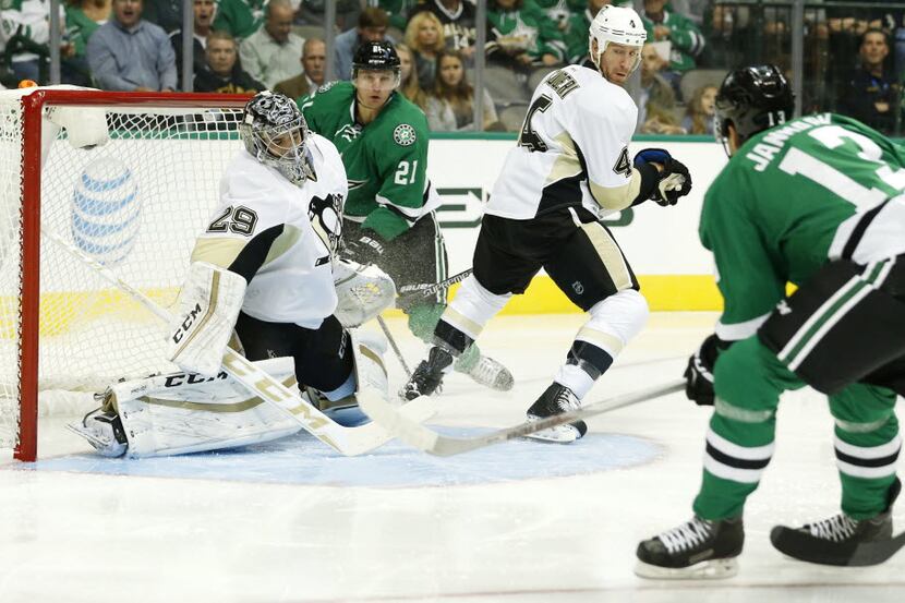Dallas Stars center Mattias Janmark (13) scores a goal on Pittsburgh Penguins goalie...