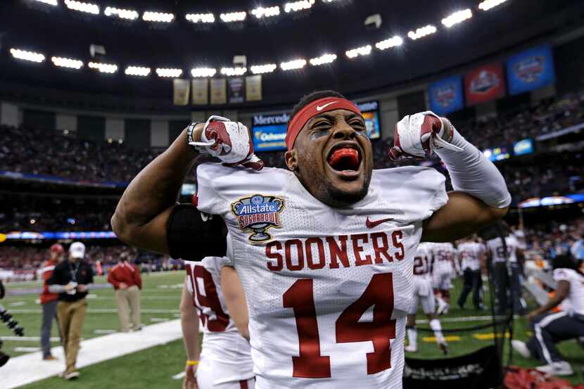 Oklahoma defensive back Aaron Colvin (14) celebrates after a touchdown in the final minute...